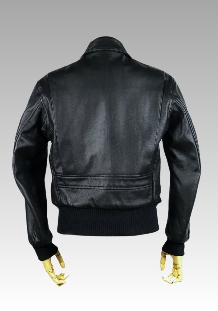 Black leather jacket with gold zipper on a mannequin against a gray background